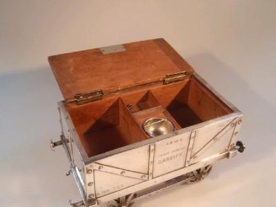 An Edwardian silver table cigarette box in the form of a railway coal truck - 2