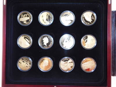 A Royal Mint gold plated set of Commemorative Coins, The Golden History of Powered Flight, cased with certificates. - 2