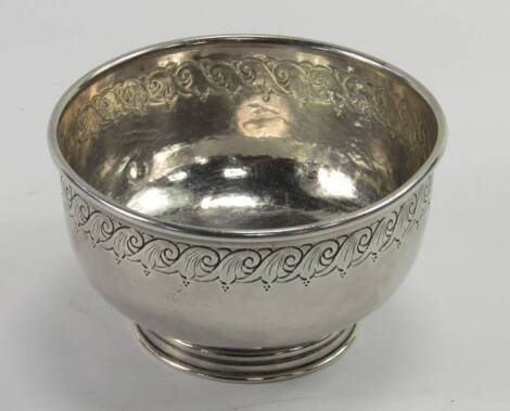 A George V silver footed bowl, engraved with a repeating scroll band, 7.7t oz, Birmingham 1918.