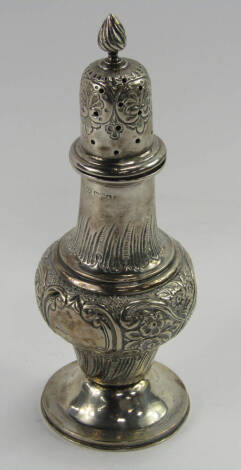 An Edward VII silver sugar sifter, of baluster form embossed with flowers, shield reserve, William Aitken, Chester 1901, 5.43t oz.