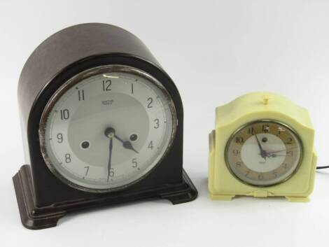 A Smiths cream Bakelite enamel alarm clock, 200/250v, together with a Smiths Enfield brown Bakelite mantel clock, silvered dial bearing Arabic numerals, eight day movement, half hour striking on a coil, 21.5cm x 12.5cm x 20.5cm, (2).