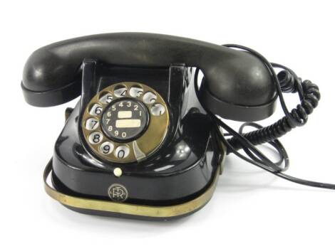 An FTTR telephone, black metal casing with Bakelite receiver, enamel dial, double bell.