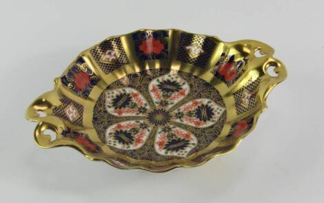 A Royal Crown Derby porcelain Old Imari sweet meat dish, circa 1988, of twin handled fluted circular footed form, 16cm x 3.5cm.