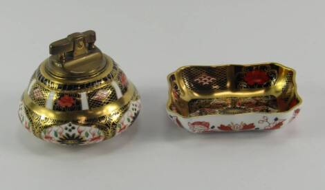 A Royal Crown Derby porcelain Old Imari table lighter, together with a rectangular, serpentine pin dish, circa 1979, boxed, (2).