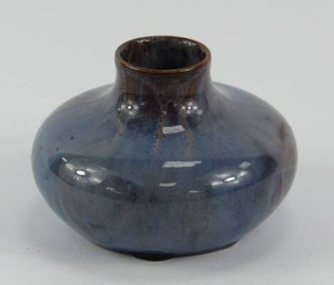 A Pilkington Royal Lancastrian pottery vase, circa 1909, of compressed circular form decorated in a turquoise glaze, impressed mark, 6.5cm high.