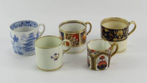 A group of porcelain coffee cans, early 19thC, including a Crown Derby can decorated with floral sprigs, Bloor Derby can decorated with gilt leaves against a cobalt blue ground, and a blue and white chinoiserie can, together with a late 19thC demi tasse c