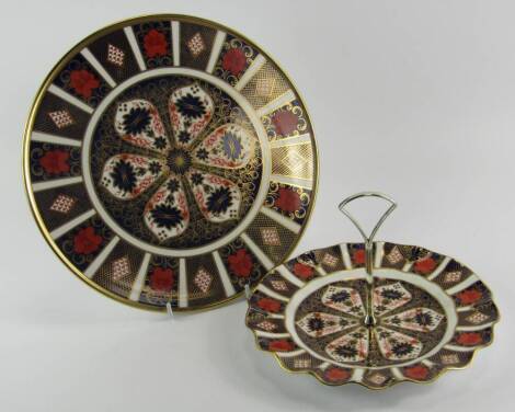 A Royal Crown Derby porcelain Old Imari fluted cake stand, circa 1984, 22cm diameter, together with a bread plate, circa 1986, 28.5cm diameter, seconds, (2).