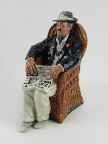 A Royal Doulton figure, modelled as Taking Things Easy HN2677.