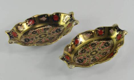 A pair of Royal Crown Derby porcelain Old Imari pin dishes, of oval serpentine form, circa 1980 and 1984, 13.5cm long, boxed.