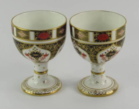 A pair of Royal Crown Derby porcelain Old Imari goblets, circa 1977 and 1980, 12.5cm high.