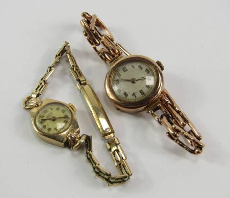 Two ladies' 9ct gold cased wristwatches, both with circular dials bearing Arabic numerals, on plated straps.