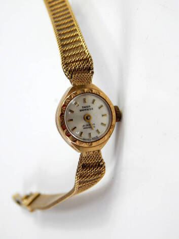 A Swiss Empress 9ct gold cased lady's wristwatch, circular silvered dial, on a 9ct gold strap, 14.9g total weight.