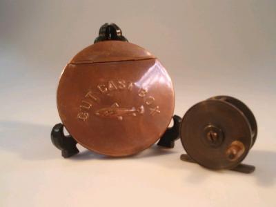 A 19thC brass fishing winch with horn handle and a vintage copper gut cast box