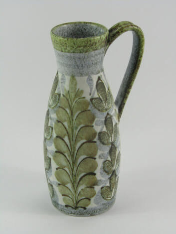 A Bourne Denby pottery jug, designed by Glyn Colledge, decorated in a stylised leaf pattern, painted marks, 23cm high.