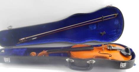 A student's violin, two piece back, with bow, cased.