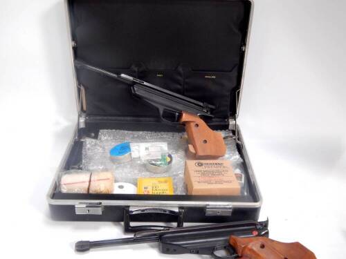 A pair of Westinger & Altenburger air pistols, mod. 80 cal 4.5/.177, with air gun pellets, in a briefcase.