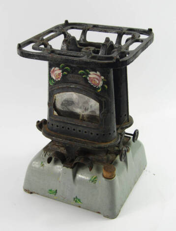 A Harper Beatrice No 33 Kerosene stove, early 20thC, with floral bargeware decoration, 28cm high.