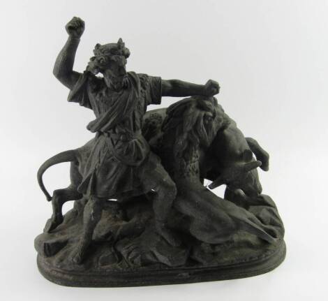 A spelter figure group, of a princely warrior and a lion attacking a bull, late 19thC, raised on a naturalistic oval base, 40cm x 70cm.