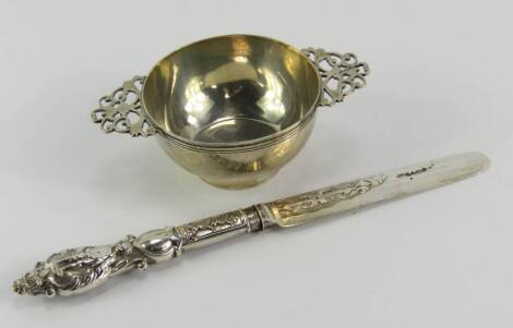 A Victorian silver quaich, with pierced handles, James Wakely & Frank Clarke Wheeler, London 1894, and a Victorian knife, the handle embossed with a putto, crown and shield reserve, Aaron Hadfield, Sheffield 1852, 3.49t oz, (2).