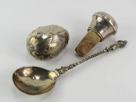 A Victorian silver spoon, with a figural terminal and spiral twist shaft, James Deakin & Sons, Sheffield 1895, 0.86t oz, silver bottle stopper and a white metal box of eliptical form embossed with leaves, stamped 800, (3).