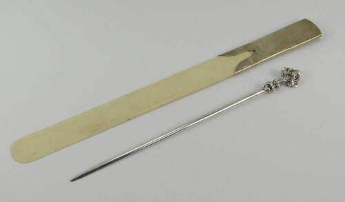 A George V ivory paper knife, with a silver mount, Birmingham 1913 and a Christofle white metal paper knife with a cast triple leaf handle, (2).