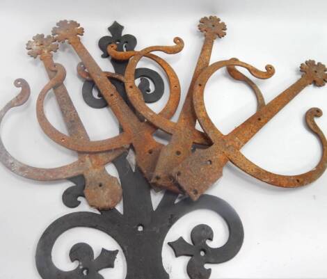 Five various antique wrought iron hinges, 71cm and 46cm.