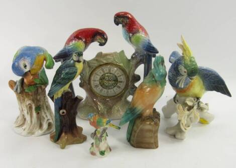 Continental porcelain figures of exotic birds, including examples by Karl Ens and Capodimonte, together with a coloured and carved onyx parrot. (5)