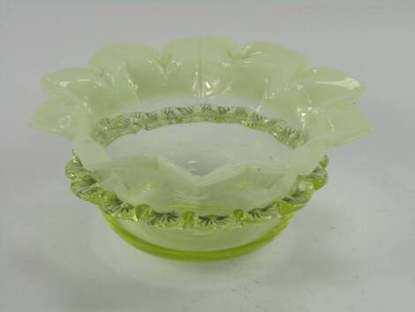 A Victorian vaseline and yellow glass bowl, 14cm diameter.