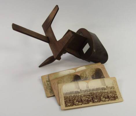 A wooden stereoscope viewer The Perfecscope, and six Underwood & Underwood stereoscopic slides.