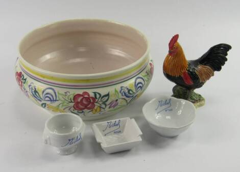 A Poole Pottery bowl, traditional painted with flowers, printed mark, 22.5cm diameter, together with a Beswick cockerel and a Revol Michel Roux three piece condiment set, (5).