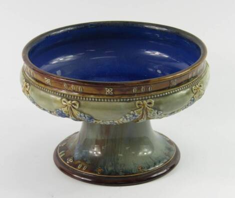 A Royal Doulton stoneware tazza, relief moulded with floral swags, impressed marks, 12cm high.