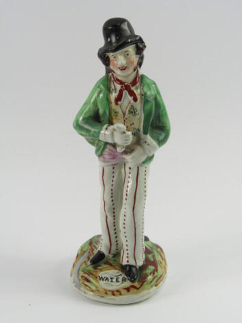 A Staffordshire pottery double sided figure, modelled as gin and water, late 19thC, raised on a naturalistic titled base, 22.5cm high.