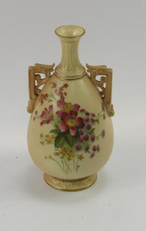 A Royal Worcester ovoid vase, model 1539, hand painted with flowers on a blush and gilt ground, (AF)