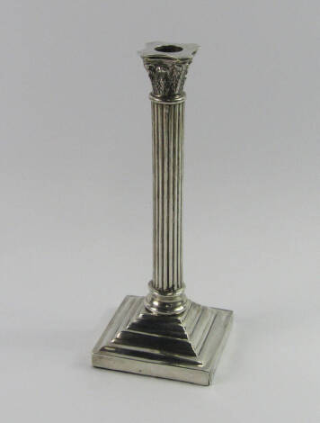 A white metal Corinthian column table lamp base, raised on a loaded, stepped square base, stamped silver, 25cm high.