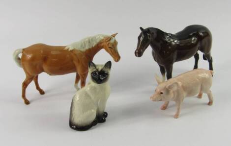 A group of Beswick animals, comprising a pig, siamese cat, palomino horse and a brown horse, (4).