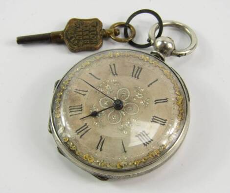 A lady's white metal cased pocket watch, open faced, key wind, silvered dial bearing Roman numerals, with key.`