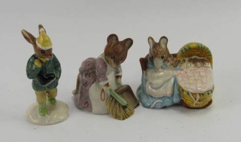 Three Beatrix Potter figures, including Hunca Munca Sweeping by Beswick, Boy Skater Bunnykins by Doulton and Hunca Munca by Royal Albert.