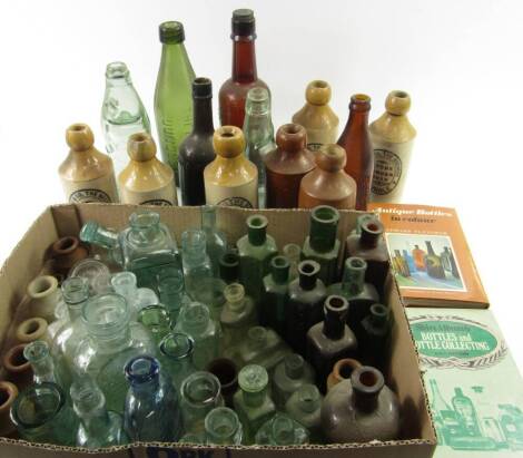 Stoneware and glass bottles, Victorian and later, including medicine, poison, ink, beer and lemonade bottles, together with two reference books on bottle collecting, (a quantity - in two boxes).