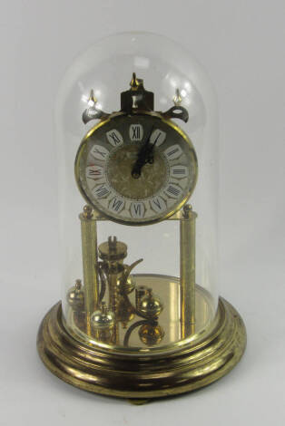 A Haller four hundred day torsion clock, silvered brass dial bearing Roman numerals, on a circular stand with glass dome, 30cm high.