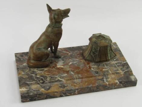 A French Art Deco cast metal and marble desk stand, modelled with a German shepherd dog, raised on a rectangular base, 25cm x 14cm x 14cm.