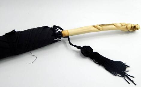 A Fox & Co black umbrella, with a horn handle carved with a rabbit and a rat, 89.5cm long.