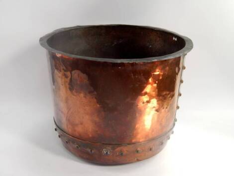 An Arts and Crafts copper log bucket, with stud work, 45cm x 34.5cm.