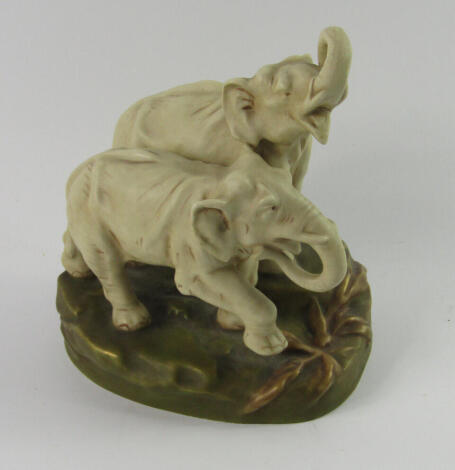 A Royal Dux blush porcelain figure group, of a pair of elephants modelled on a naturalistic base, No 2705, impressed and triangle marks, 17cm high.