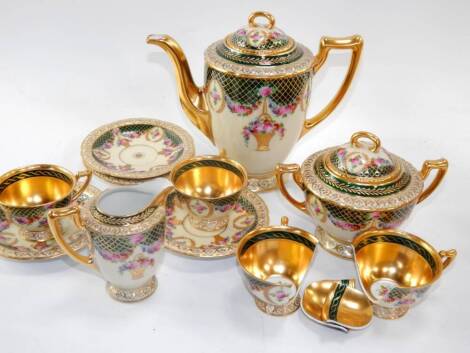 A Hutschenreuther porcelain part coffee service, early 20thC, painted with swags and baskets of flowers against a green and gilt net border, comprising coffee pot, cream jug, sucrier and four cups and saucers, (AF).