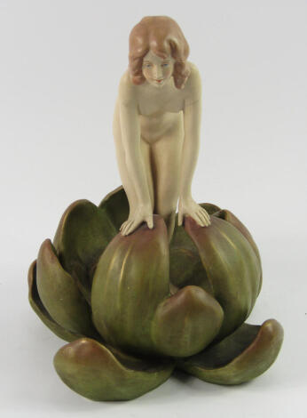 A Royal Dux blush porcelain figure, of a naked woman modelled emerging from a water lily, No 2857, impressed and triangle marks, 23.5cm high, (AF).