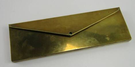 A brass glove box, of rectangular envelope form, containing long matches, 29cm x 9.5cm x 2cm.