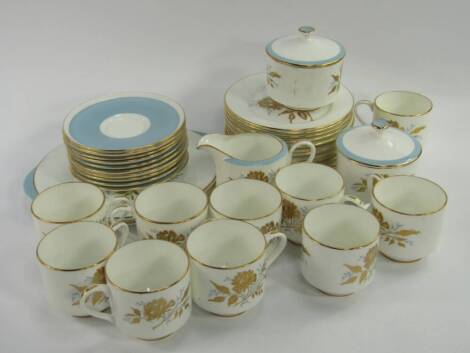 An Aysnley porcelain part tea service, decorated in the Golden Grace pattern, comprising a pair of bread plates, cream jug, a pair of sucriers, ten cups and saucers and twelve tea plates, (37), (AF).