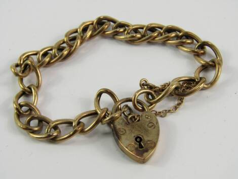 A 9ct gold oval link bracelet, on a heart shaped padlock clasp with safety chain, as fitted, 5.7g.