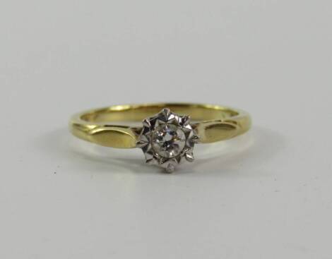 An 18ct gold diamond solitaire ring, with illusion set diamond centre.