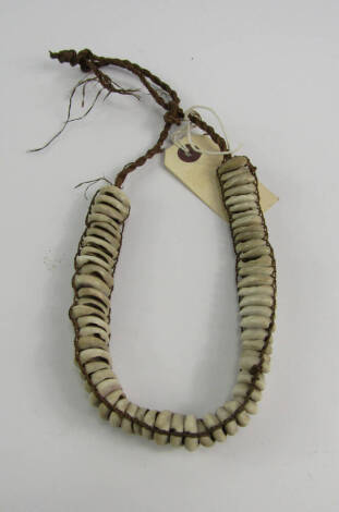 Tribal Art. A 19thC tribal shell necklace probably from the South Seas, approximately 40cm.